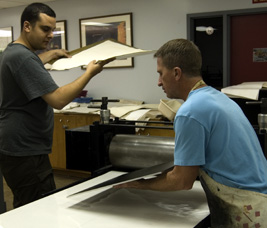 paul and oscar setting up the press