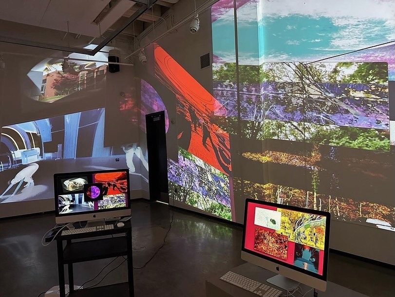 An immersive workshop installation covering multiple walls with projected images